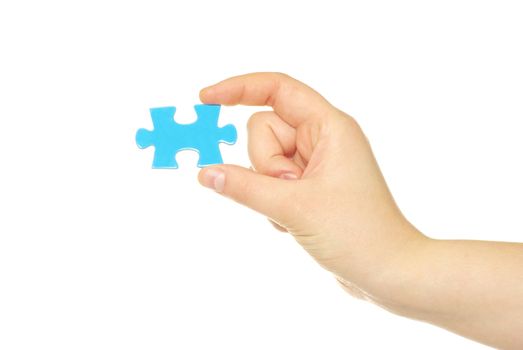 hand holding a puzzle piece
