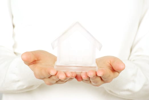The house in human hands on white