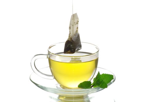 tea in cup with leaf mint  isolated on white 