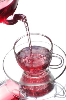 Tea being poured into glass tea cup