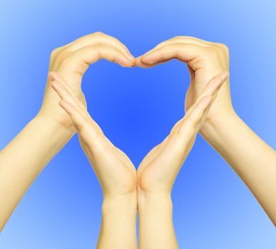  woman’s hands made in the form of heart