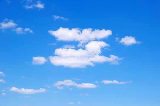 blue sky background with tiny clouds