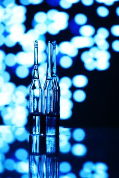 ampoule on abstract bokeh background