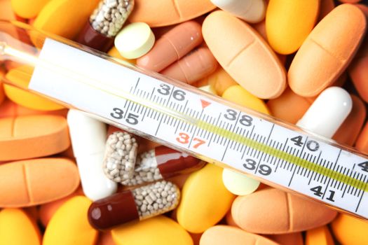 thermometer and drugs medical background