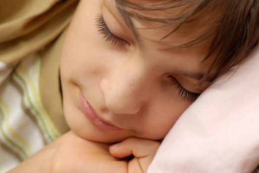 caucasian boy portrait, sleeping with arm under cheek