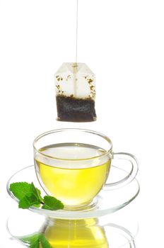 tea in cup with leaf mint  isolated on white background