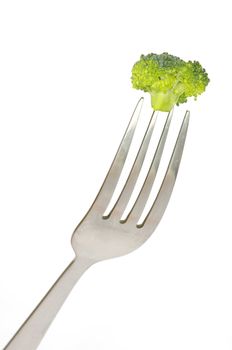 fork and broccoli on white