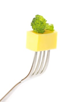 cheese and salad on a fork isolated on white background