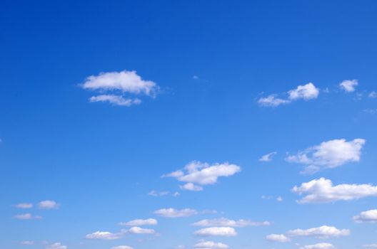 blue sky background with tiny clouds