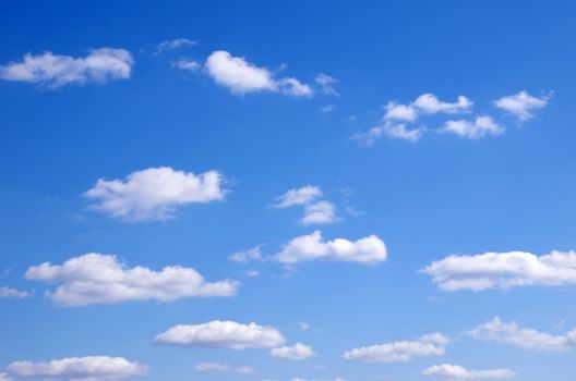blue sky background with tiny clouds