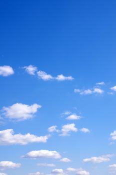 blue sky background with tiny clouds