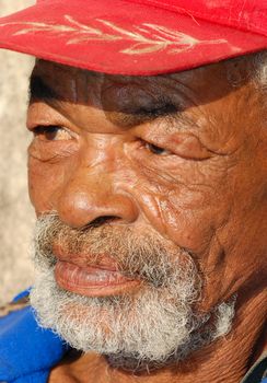 Closeup of an mature brown man with a caracterful face