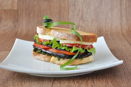  Sandwich with eggplant, tomatoes, peppers and cheese