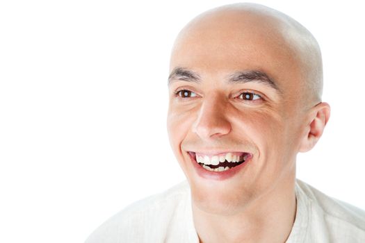 Close-up of a bald man's face smiling, isolated on white background