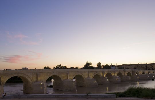 Roman bridge at dusk, Cordoba, Andalusia, Spain
