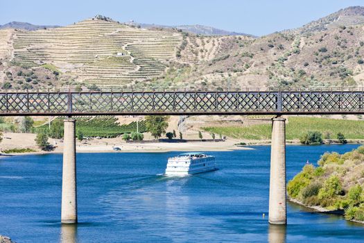 railway viaduct and cruise ship in Pocinho, Douro Valley, Portugal