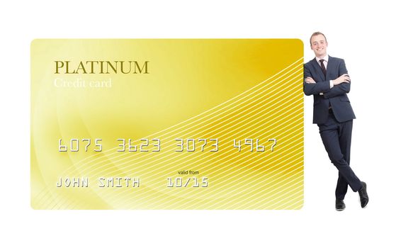 Businessman leaning on credit card