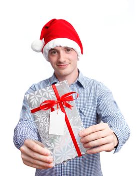 Man with santa hat holding christmas present