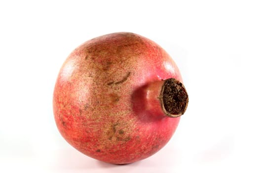 a fresh pomegranate on a white background