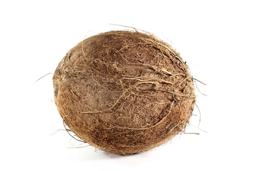 a fresh coconut in front of white background