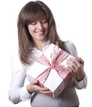 Young smiling woman holding gift - light box with a bow