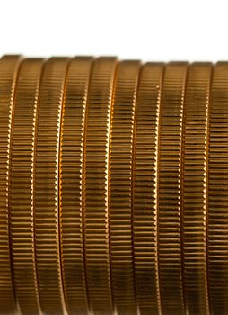 Gold Eagle one ounce coins in a stack and isolated against white