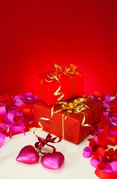 St. Valentine's day presents and hearts over red background