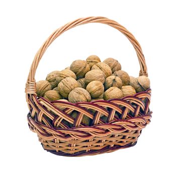 wicker basket with walnuts isolated on a white background