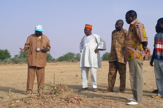 African waterfinder with work in an area of Burkina Faso Faso. Water is not rare in Africa, only it is necessary to drill wells to reach it. The waterfinder thus determines the place exact where to drill because drilling costs 8000 ? and it is not question of missing the place where the machines will have to work.