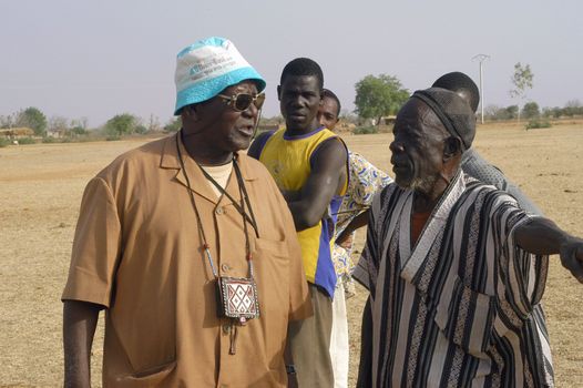African waterfinder with work in an area of Burkina Faso Faso. Water is not rare in Africa, only it is necessary to drill wells to reach it. The waterfinder thus determines the place exact where to drill because drilling costs 8000 ? and it is not question of missing the place where the machines will have to work.