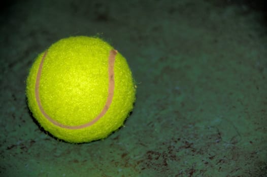 tennis ball on green background