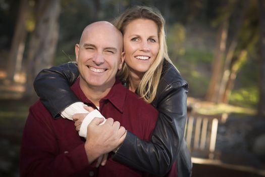 Attractive Hugging Young Couple Portrait in the Park.