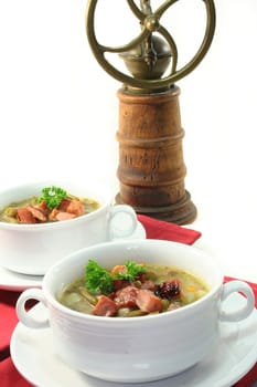 Green bean stew in a white soup cup