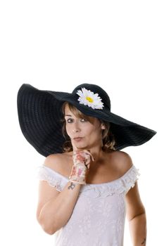 Studio portrait of attractive woman in a large black hat isolated on white