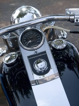 Front of black and chrome, custom made motorcycle.
