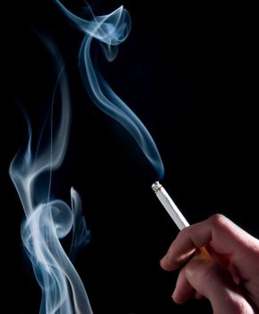 Cigarette and smoke on a black background