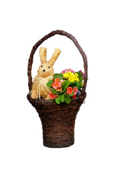 Busket with flowers, bunny and eggs for Easter celebrating