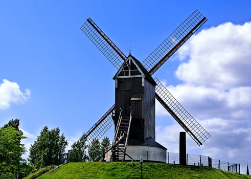 Old windmill against the sky background