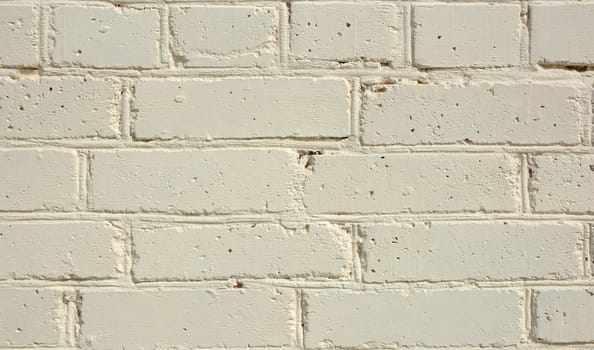 Brick wall painted in light yellow color.