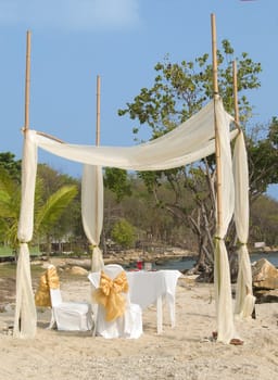 Party table and decoration on a tropical beach