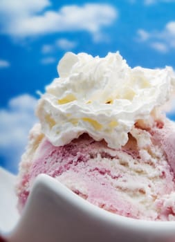 Pink ice cream on a blue sky