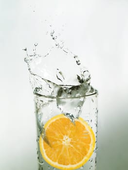 Orange slice in a glass of water