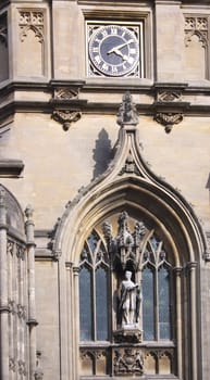 Detail of the main tower of Christ Church, Oxford, UK, named after the bell "Old Tom" it hauses. Christ Church is one of the colleges of Oxford Univeristy and at the same time the Cathedral church of the diocese of Oxford.