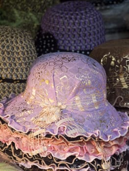 Stacks of hats in a market.