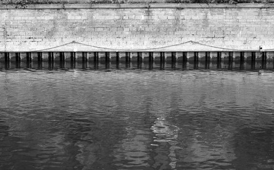 Old stone border of the river Thames in Oxford, UK.