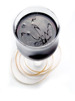 Glass of red wine on a white background