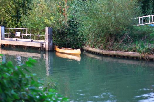 An old boat at the river lock of the Thames, Oxford, UK