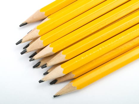 Yellow pencils on a white background
