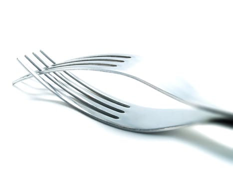 Two forks on a white background