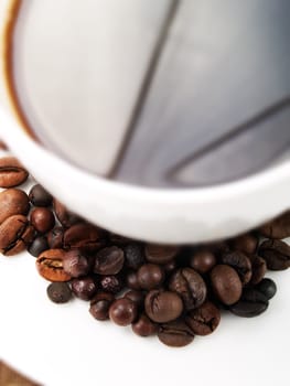 Coffee beans on a coffee cup